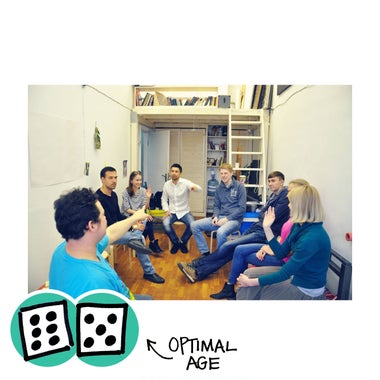 People sitting in a circle playing Mafia.